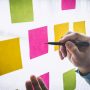 Businessman use post it notes to planning idea and business marketing strategy